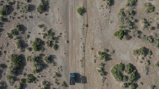 alt overhead view of ATV driving up across Nevada desert