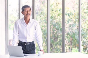 Fototapeta premium Asian Business old man in the meeting room at the office
