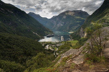 Fototapeta na wymiar View over Geiranger town and the Geiranger fjord, where many cruise ships dock during the summer. Norwegian landscape