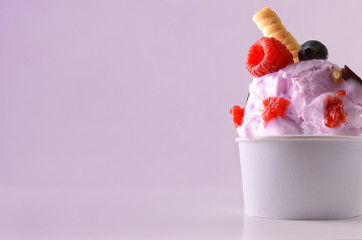 Berries ice cream cup on table isolated close up