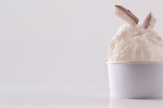 Coconut ice cream cup on table isolated close up