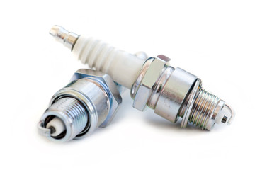 Two spark plugs on white