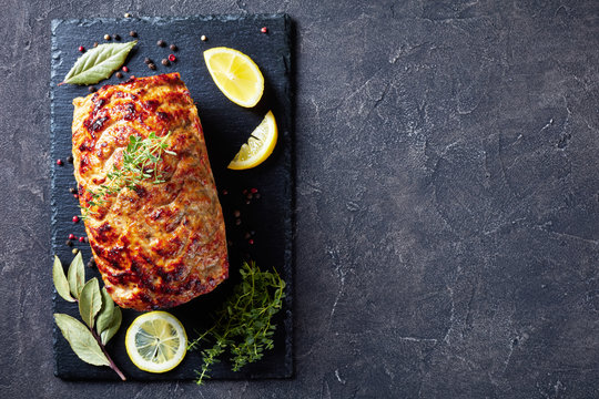 baked chicken meatloaf on a slate tray