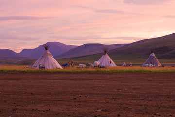 Summer camp of nomadic reindeer herders at dawn. Yamal, Russia