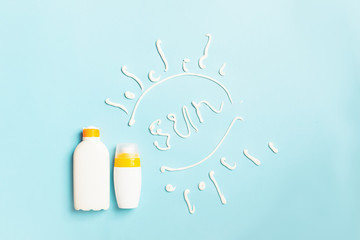 Sunscreen in bottles pattern and the phrase SUN on a bright blue background. Summer holiday concept and beach.