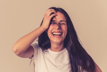 Portrait of young attractive cheerful woman with smiling happy face. Human expressions and emotions