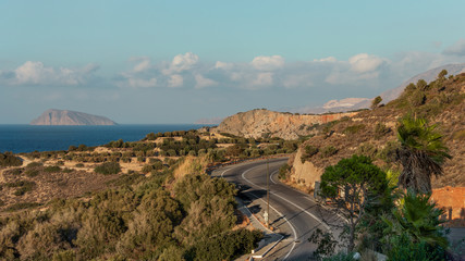 Greece, Crete. Landscape, sea, sunset, mountains, sun.