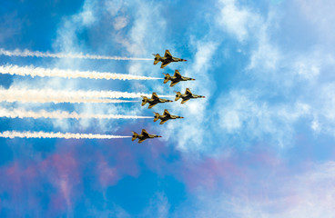 Spectacular flight in the blue sky of several planes in Paris. Bastille Day.