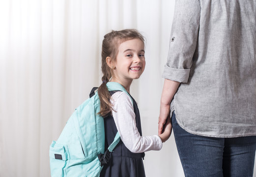 Parent and primary school student go hand in hand