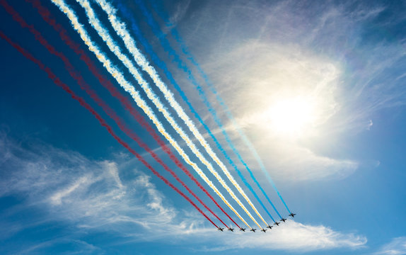 Flying several planes in the blue sky, Bastille Day. France flag