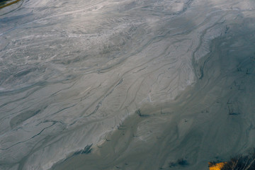 Fototapeta premium Drone view of contaminated, toxic water stream in Geamana, Romania
