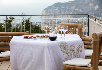 Prepared for supper table on the terrace overlooking the Bay of Naples and  Vesuvius. Sorrento. Italy