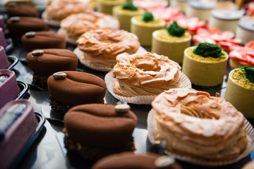 Delicious cakes on display with dark background