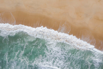 Fototapeta na wymiar Atlantic ocean sandy beach with turquoise ocean and waves. Aerial view