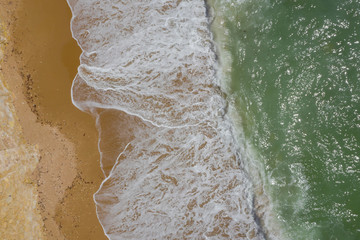 Atlantic ocean sandy beach with turquoise ocean and waves. Aerial view