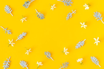 Floral pattern with white flowers and leaves on yellow background