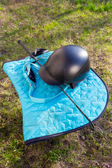 Equipment for horse riding outdoors: bridle, whip, helmet, bandages