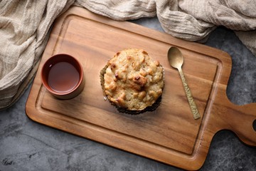 Butter scotch on wooden plate and stone background
