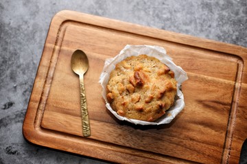 Butter scotch on wooden plate and stone background