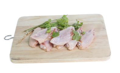 Raw chicken  on cutting board on white background