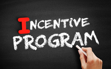 Incentive program text on blackboard, business concept background