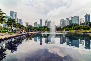 Naklejka premium 22 Apr 2019. Kuala Lumpur, Malaysia. The twin towers of Petronas. Central Park.