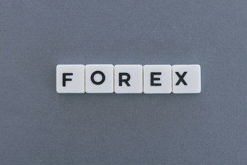 Forex word made of square letter word on grey background.