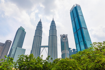 Naklejka premium 22 Apr 2019. Kuala Lumpur, Malaysia. The twin towers of Petronas. Central Park.