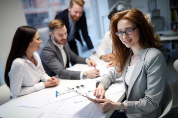 Business people working together on project and brainstorming in office