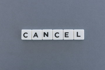 Cancel word made of square letter word on grey background.