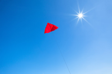 red kite in the blue sky
