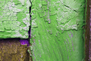 Old wooden background with remains of pieces of scraps of old paint on wood. Texture of an old tree, vintage wood background peeling paint. old blue board with cracked paint
