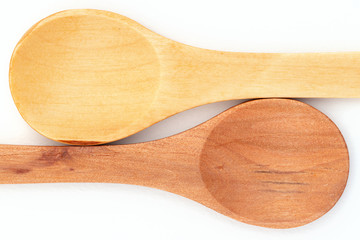 Two wooden teaspoons arranged head to toe, ying yang style