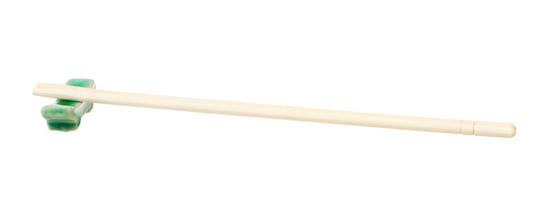 side view of carved disposable chopsticks on rest