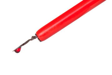 ink drop on tip of nib of red dip pen close up