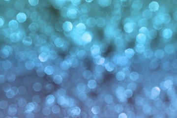 light blue brilliant metall sand made of glitters - xmas concept with bokeh texture - fantastic abstract photo background