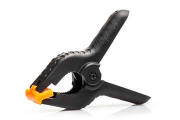 Black plastic spring clamp, isolated on white background