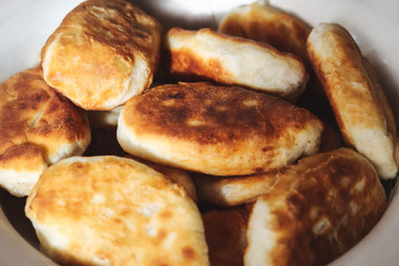 Ready homemade fried pies on a plate.