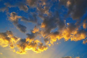 Fototapeta na wymiar Sunset clouds with light rays
