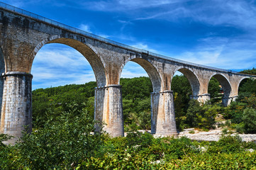 Stone, Railway viaduct over the River Ardeche in France..