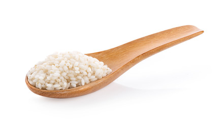 white rice in wood spoon isolated on white background. full depthb of field