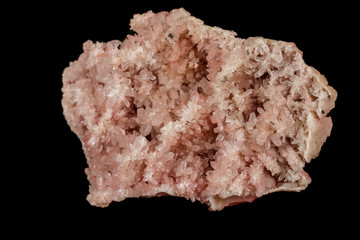 Macro stone mineral pink quartz amethyst on a black background