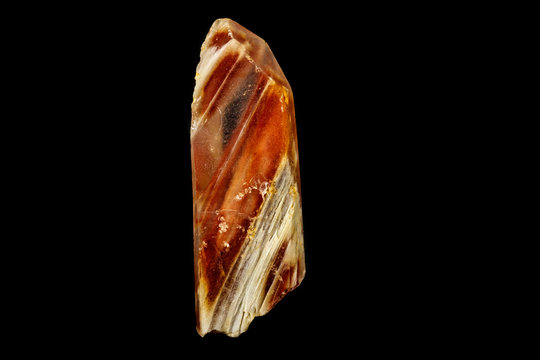 Macro of a mineral quartz stone with lepidokrokit on a black background