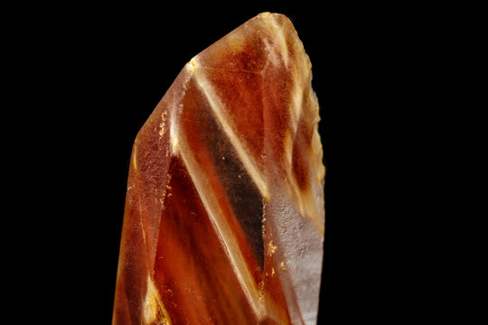 Macro of a mineral quartz stone with lepidokrokit on a black background