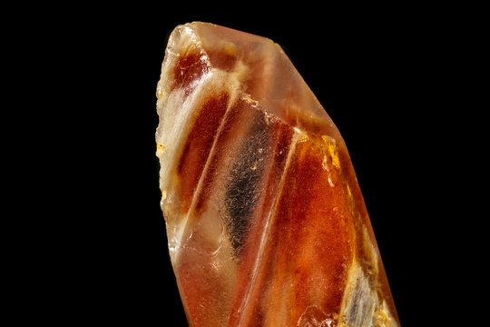 Macro of a mineral quartz stone with lepidokrokit on a black background