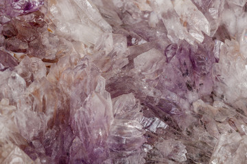 Macro of amethyst mineral stone on black background