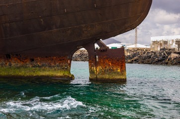 Close up view of ship wreck of Temple Hall with the Port of Arrecife in background