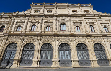 Fototapeta na wymiar The view of Seville Town hall, built in plateresque style, in San Francisco Square, Spain .