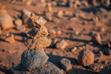 Balance concept. A small stone tower. Stack of stones, selective focus