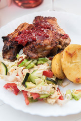 grilled meat with vegetables and sauce